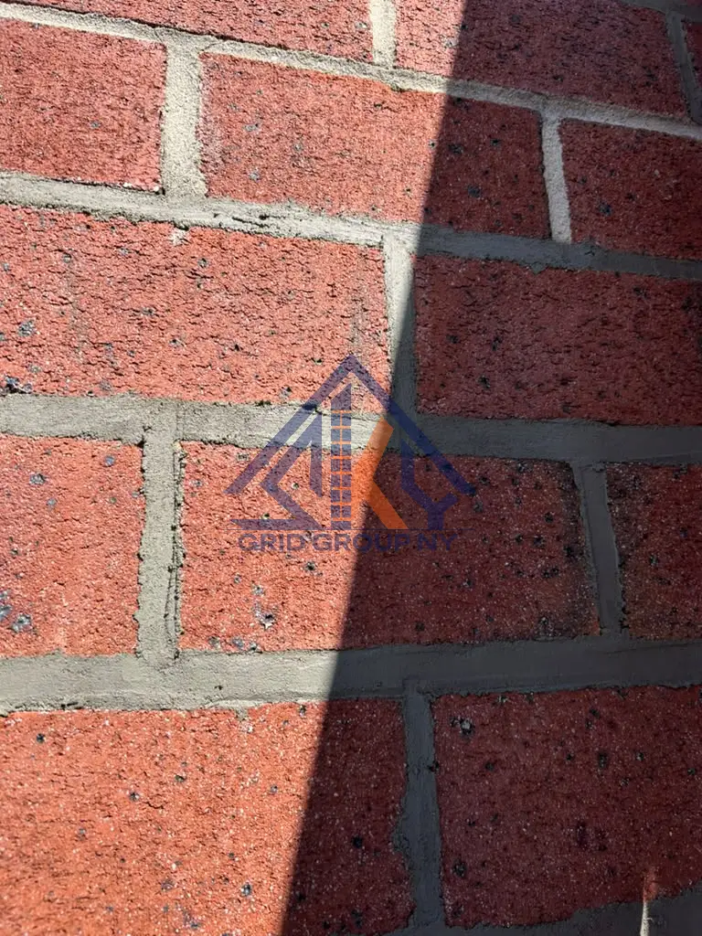 Freshly packed Type N mortar joints in red brick at 46-11 88th Street, Elmhurst, Queens