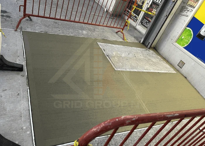 NYC DOT sidewalk violation removal with newly poured concrete sidewalk